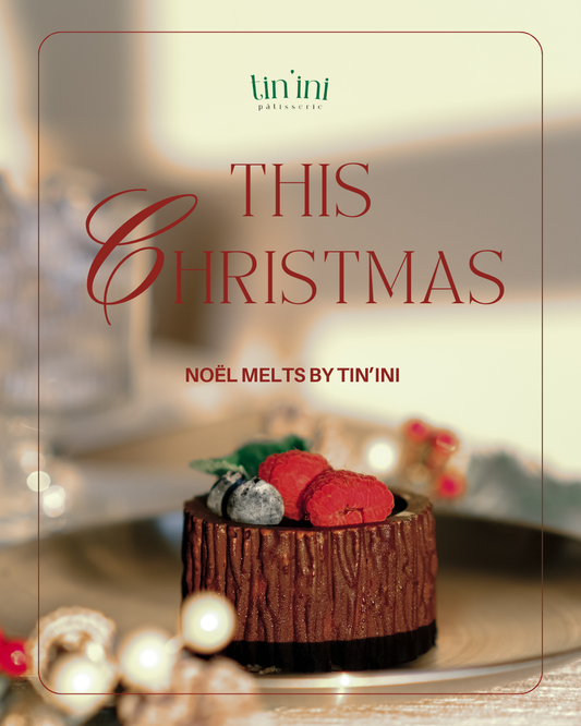 Advertisement for Tin'ini chocolates featuring a Christmas-themed dessert with red and gray decorations.